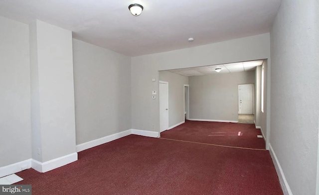 empty room with dark carpet