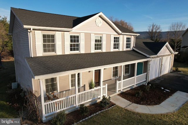 view of front of house with a garage and covered porch