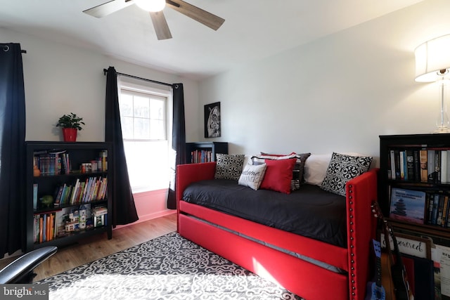 bedroom with hardwood / wood-style flooring and ceiling fan