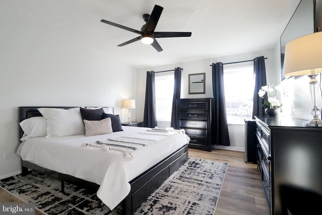 bedroom featuring hardwood / wood-style floors and ceiling fan