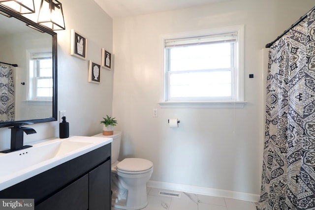 bathroom with vanity and toilet