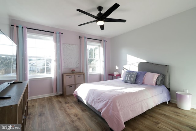 bedroom featuring dark wood-type flooring and ceiling fan