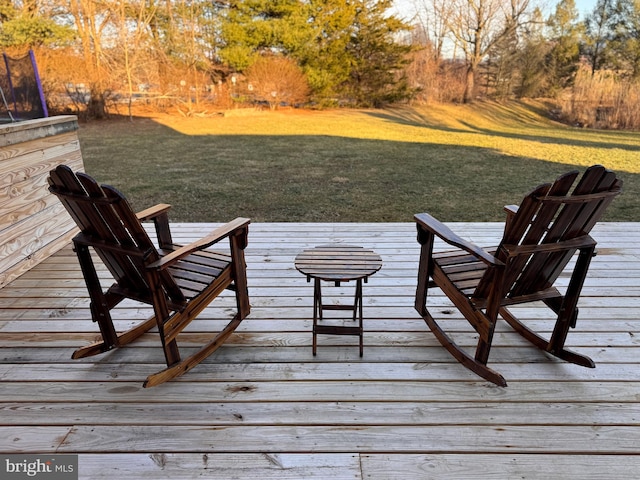 wooden terrace with a yard