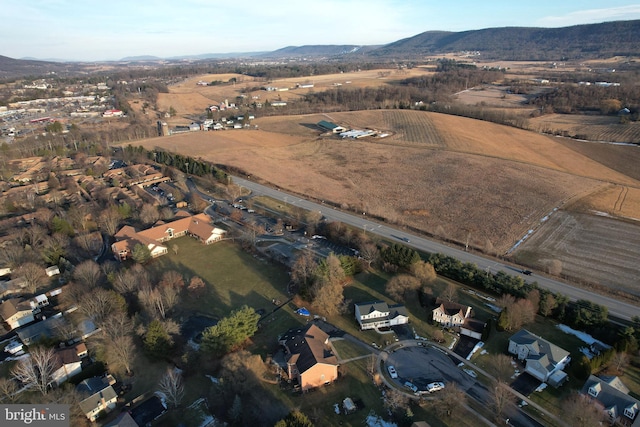 birds eye view of property featuring a mountain view