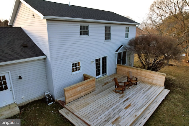 back of property featuring a deck