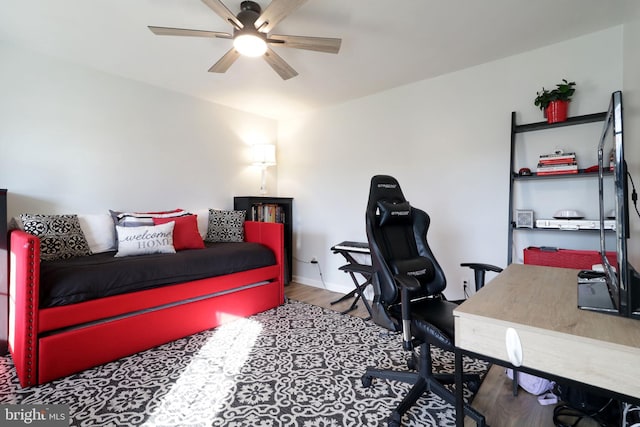 bedroom with ceiling fan and wood-type flooring