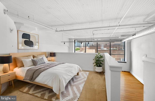 bedroom with light hardwood / wood-style floors