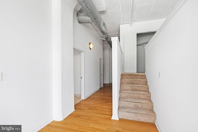 stairway featuring hardwood / wood-style floors