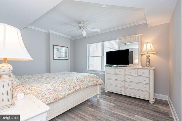 bedroom featuring wood-type flooring, ceiling fan, and crown molding