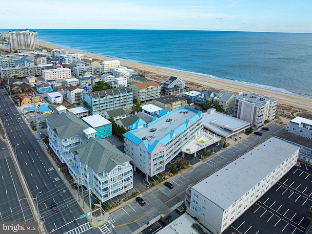 aerial view featuring a view of the beach and a water view