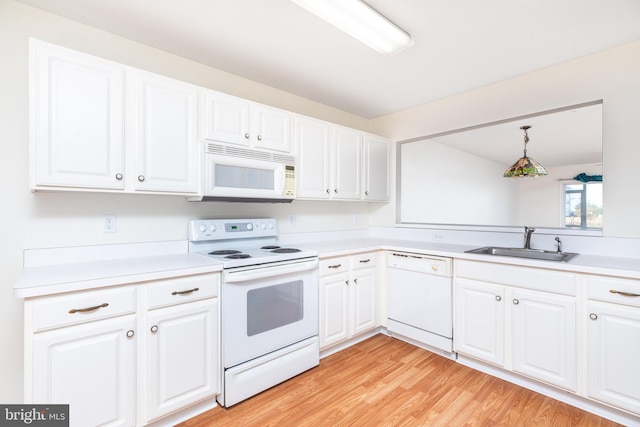 kitchen featuring white cabinetry, white appliances, sink, and light hardwood / wood-style flooring