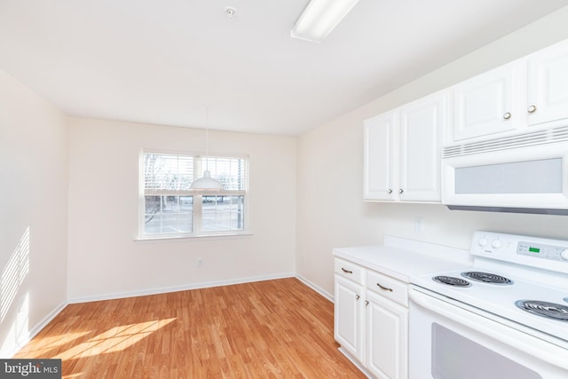 kitchen with white cabinetry, light wood-type flooring, pendant lighting, and white appliances