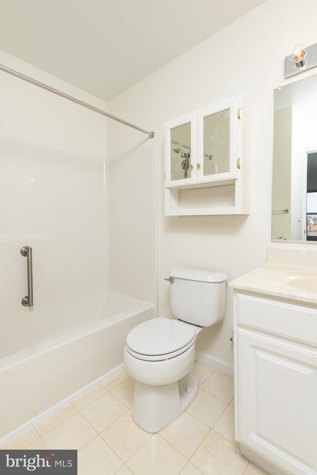 full bathroom featuring tile patterned floors, toilet, shower / washtub combination, and vanity