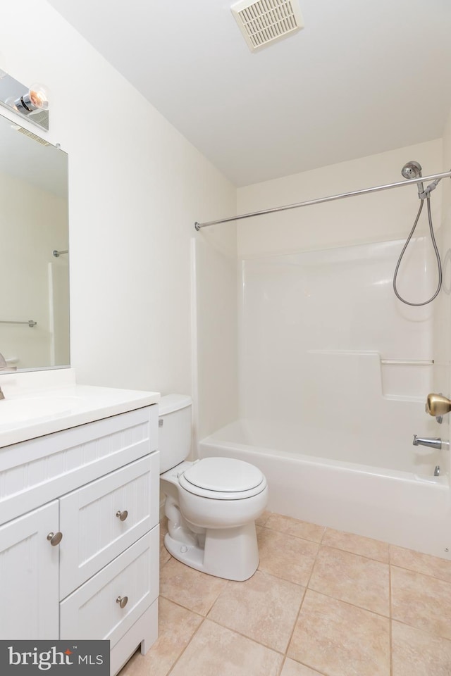 full bathroom with tile patterned flooring, vanity, shower / tub combination, and toilet