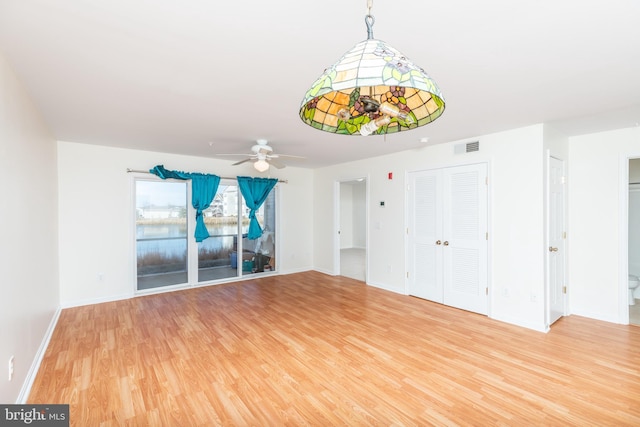 interior space with hardwood / wood-style flooring and ceiling fan