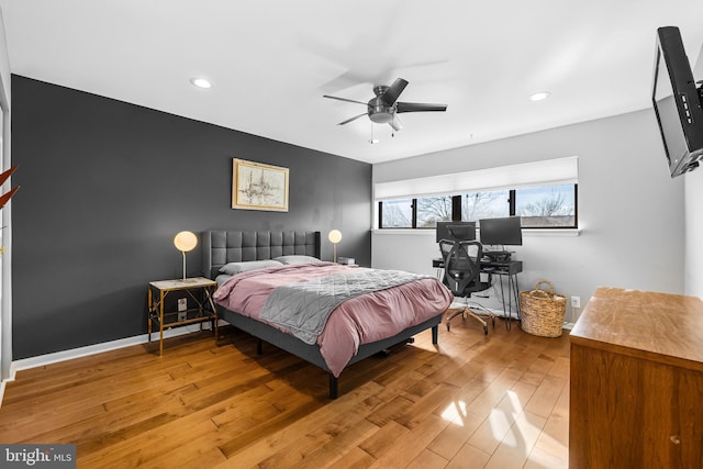 bedroom with hardwood / wood-style flooring and ceiling fan