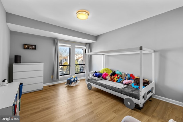 bedroom featuring light wood-type flooring