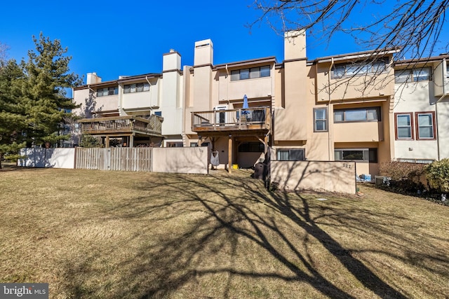 rear view of house with a yard