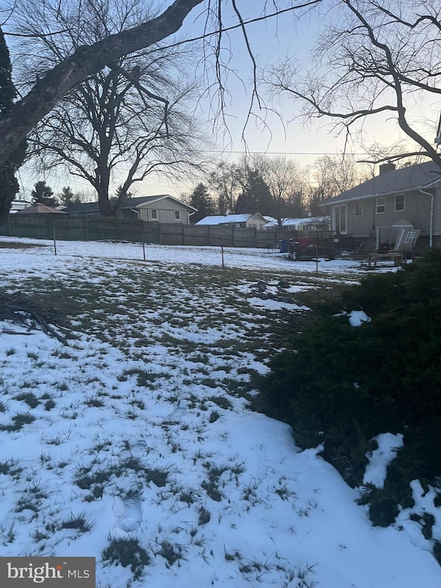 view of yard covered in snow