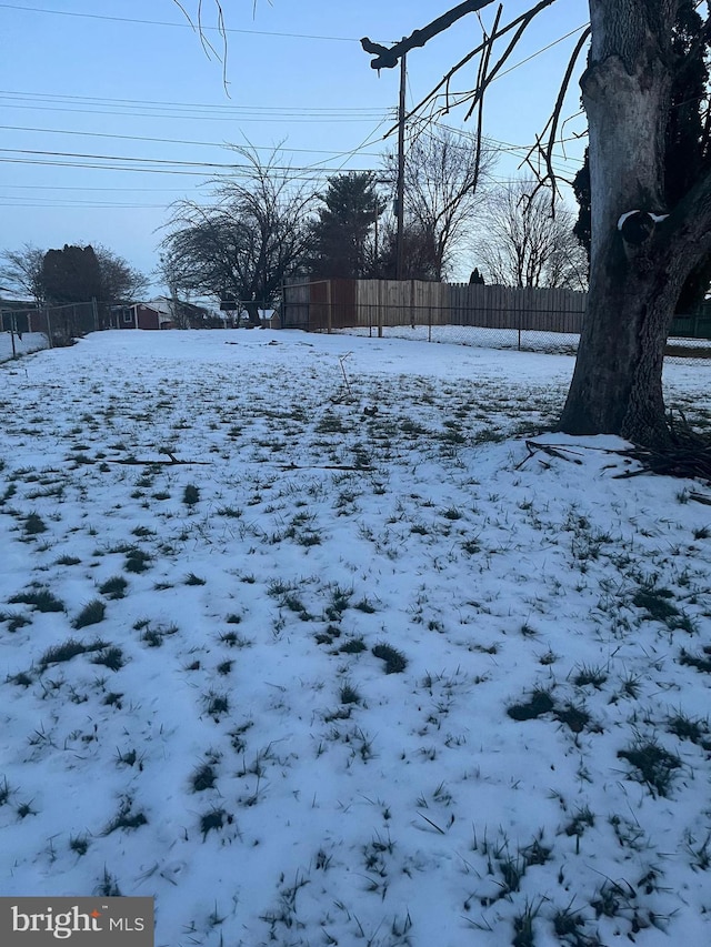 view of yard layered in snow