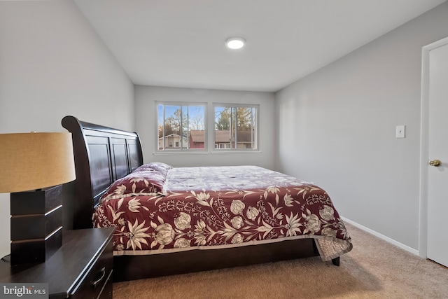 bedroom with carpet flooring and baseboards