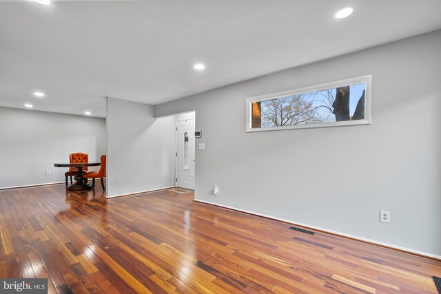 below grade area with recessed lighting and wood-type flooring