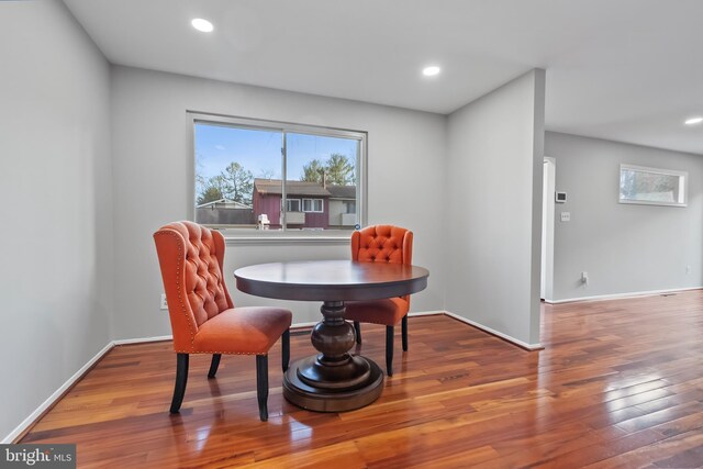 dining space with hardwood / wood-style floors, recessed lighting, and baseboards