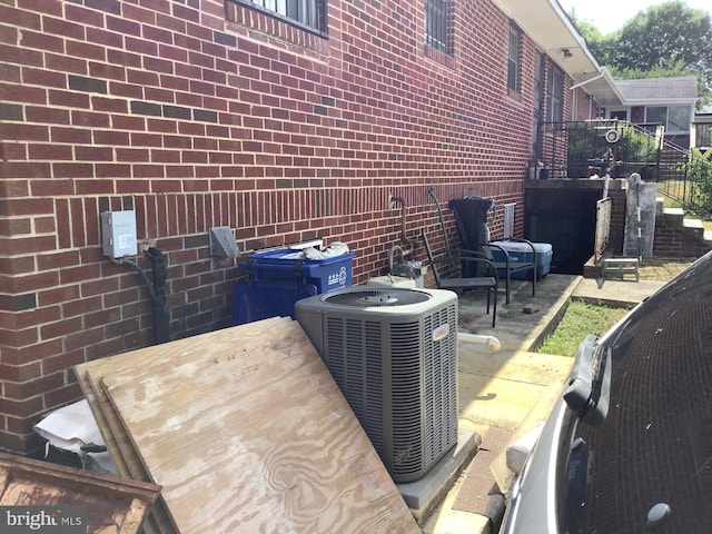 view of side of property featuring cooling unit