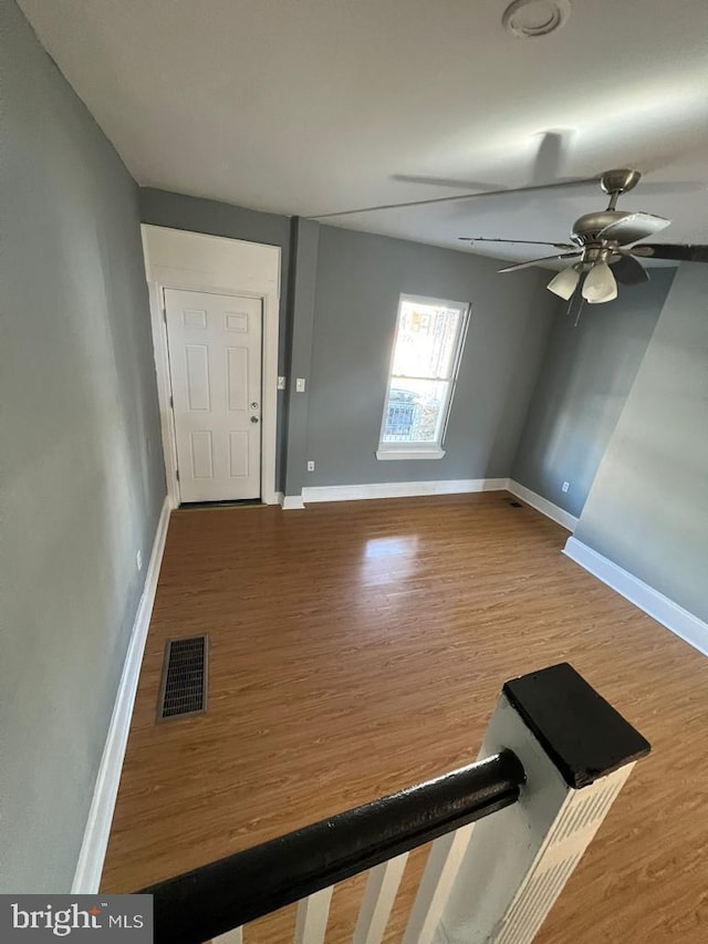 foyer featuring hardwood / wood-style flooring and ceiling fan