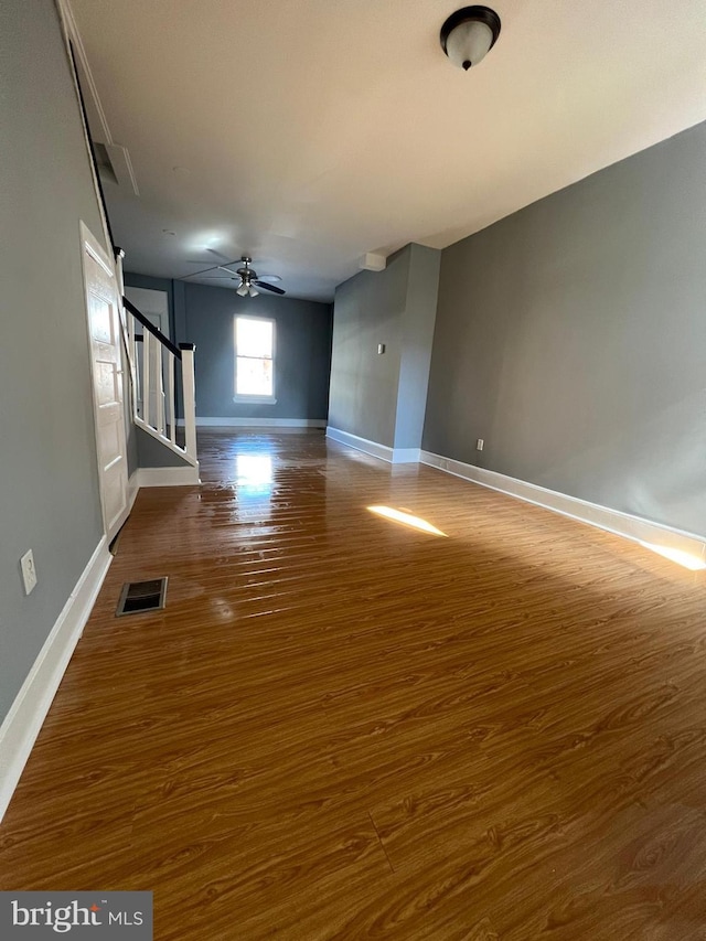 spare room with ceiling fan and wood-type flooring