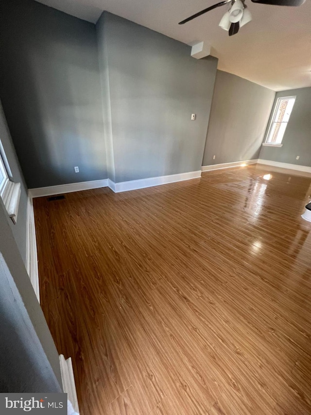 spare room featuring ceiling fan and hardwood / wood-style floors