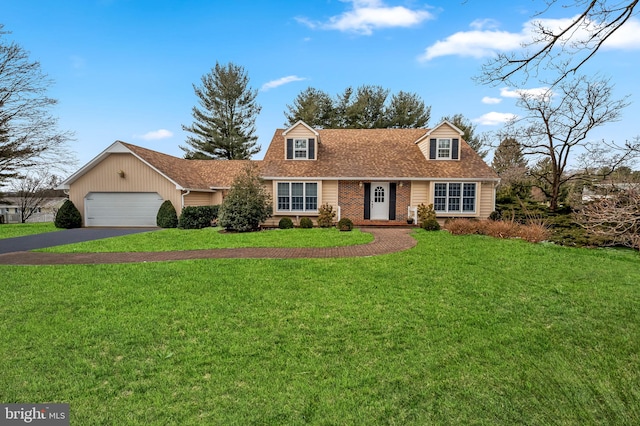 cape cod home with a garage and a front yard