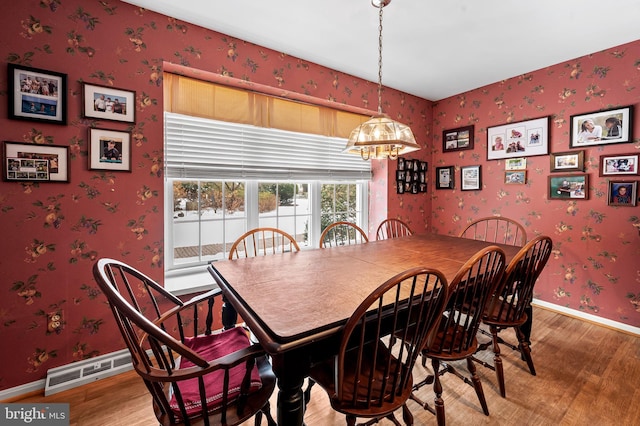 dining room with hardwood / wood-style floors