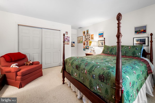 carpeted bedroom with a closet