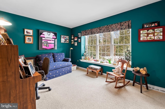 sitting room featuring carpet floors