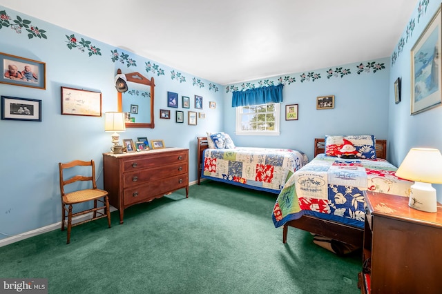 bedroom with dark colored carpet