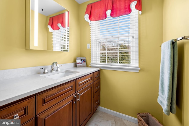 bathroom featuring tile patterned flooring and vanity