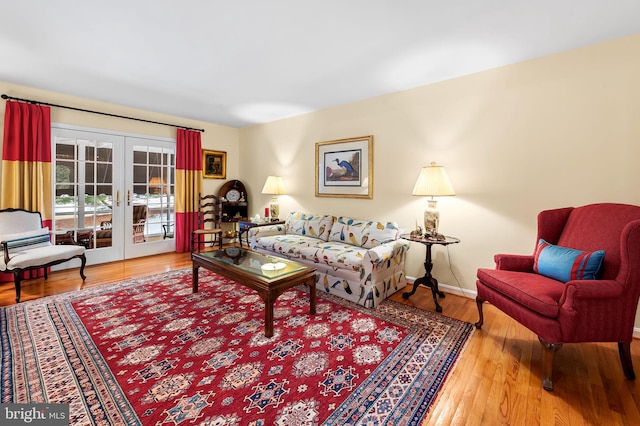 living room featuring wood-type flooring and french doors