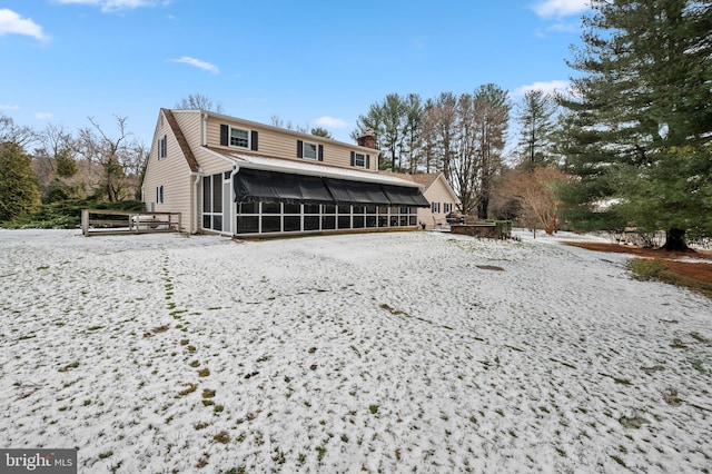 rear view of house with a sunroom