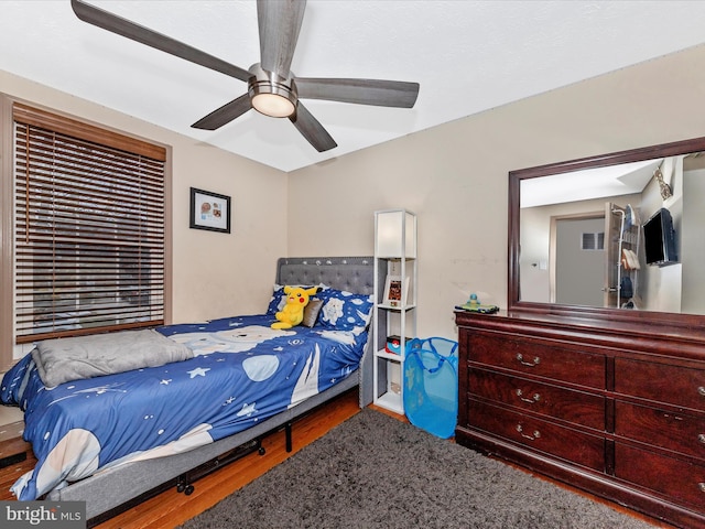 bedroom with hardwood / wood-style flooring and ceiling fan