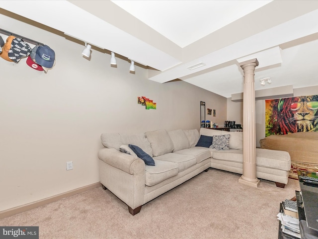 carpeted living room featuring decorative columns