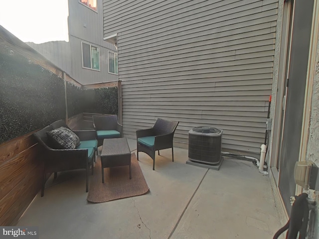 view of patio / terrace with cooling unit and an outdoor hangout area