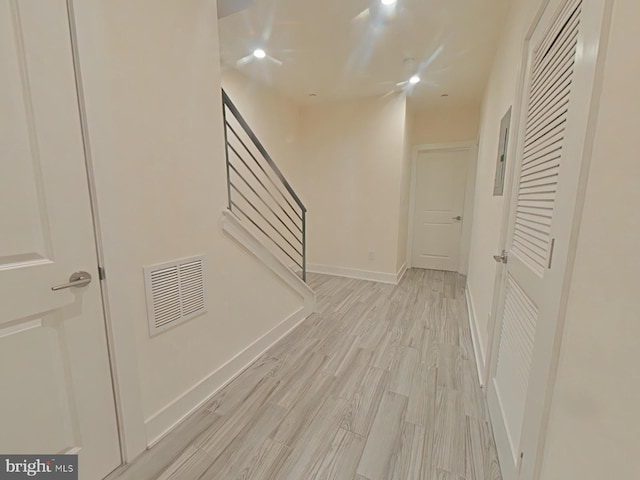 hall with light hardwood / wood-style floors