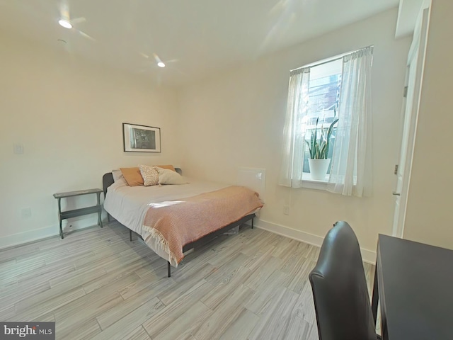 bedroom with light wood-type flooring