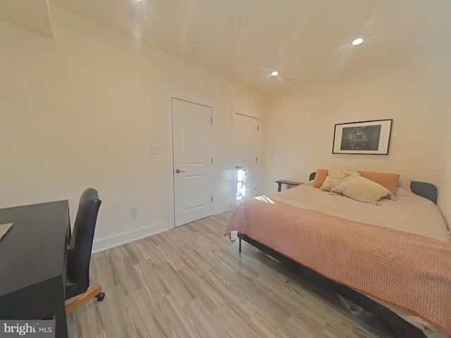 bedroom with light hardwood / wood-style floors