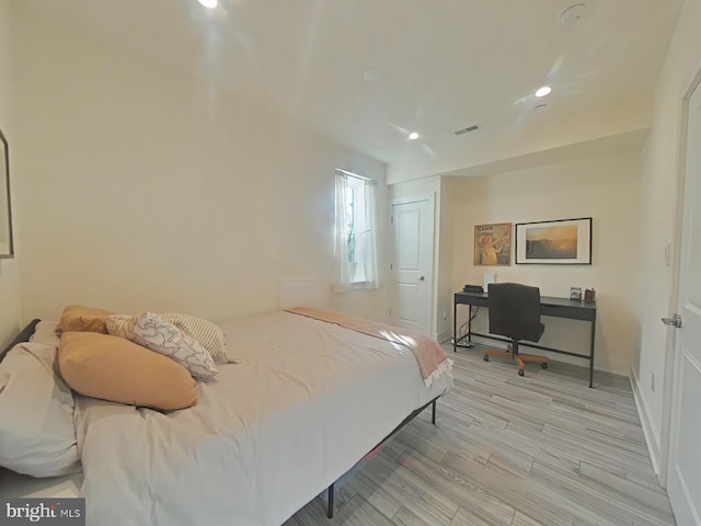 bedroom featuring light hardwood / wood-style floors