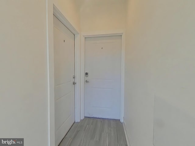 doorway to outside with light hardwood / wood-style flooring