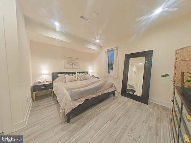 bedroom with light hardwood / wood-style flooring