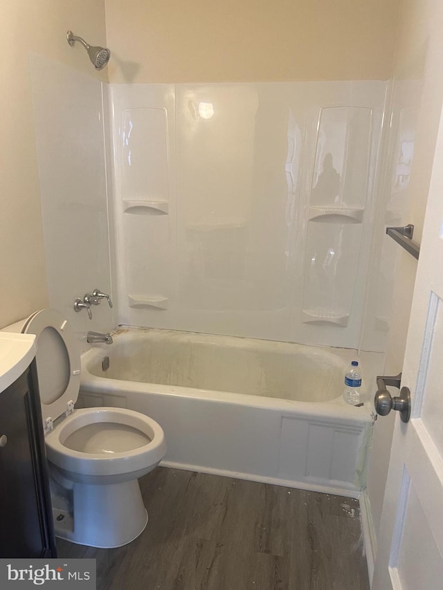 full bathroom featuring shower / tub combination, vanity, toilet, and hardwood / wood-style floors