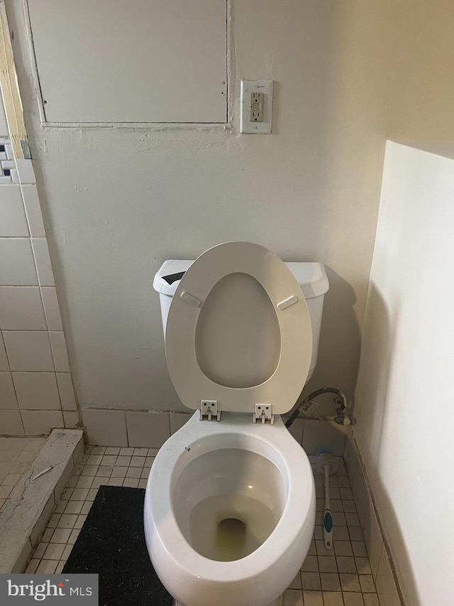 bathroom featuring tile patterned floors and toilet